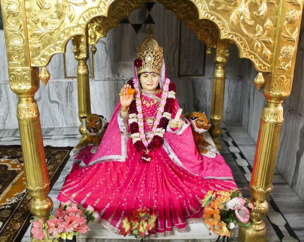 Maa Bhameshwari enshrined at the mother temple in Bham, Hoshiarpur, Punjab — seated beneath a golden arch