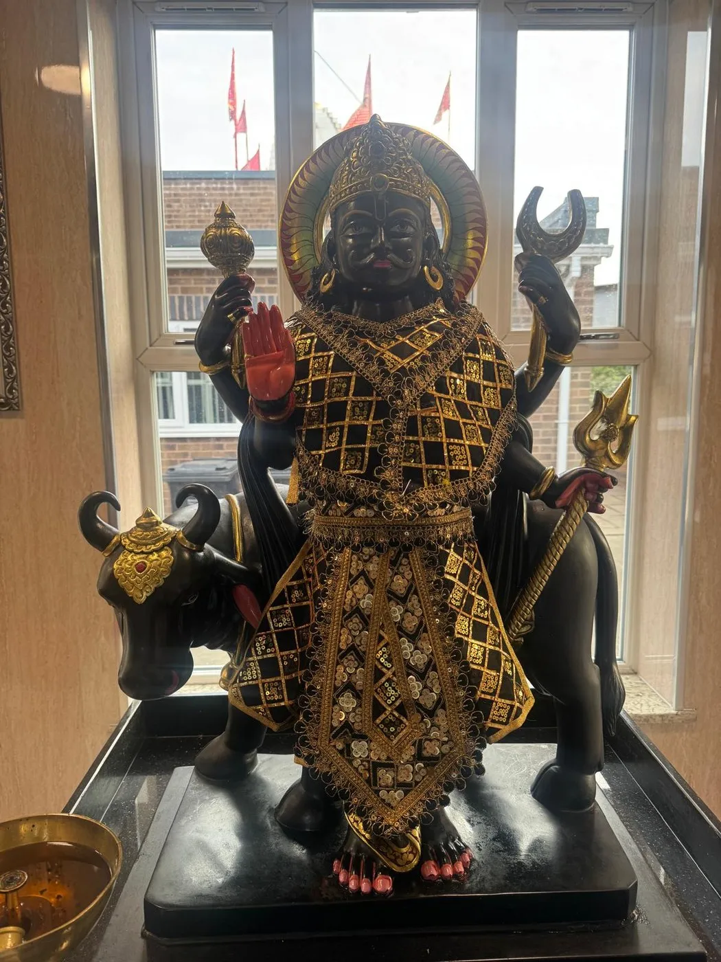 Shani Dev at Shri Maha Kali Bhameshwari Mandir, dressed in the shringar of a different day (2 of 2)